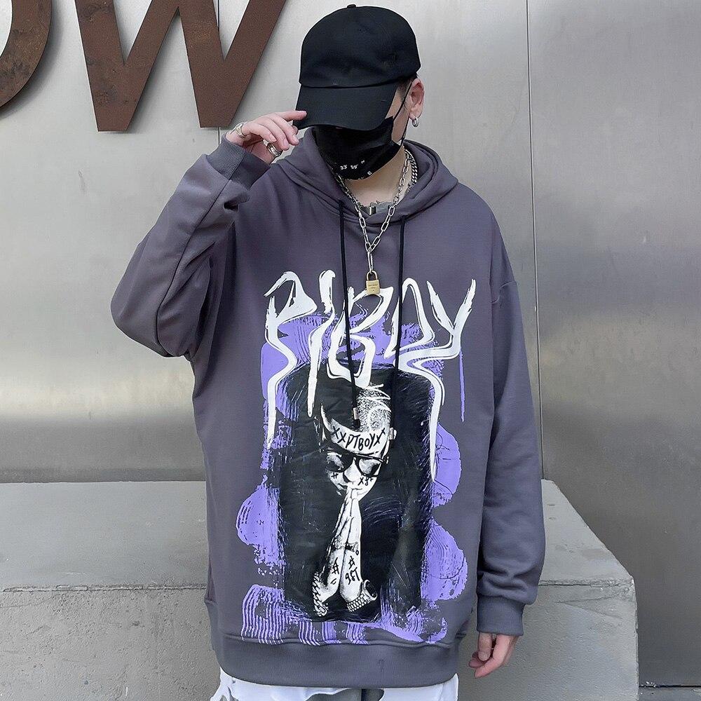 A stylish black hoodie featuring a vibrant graffiti print, designed for men and youth, perfect for high street fashion.