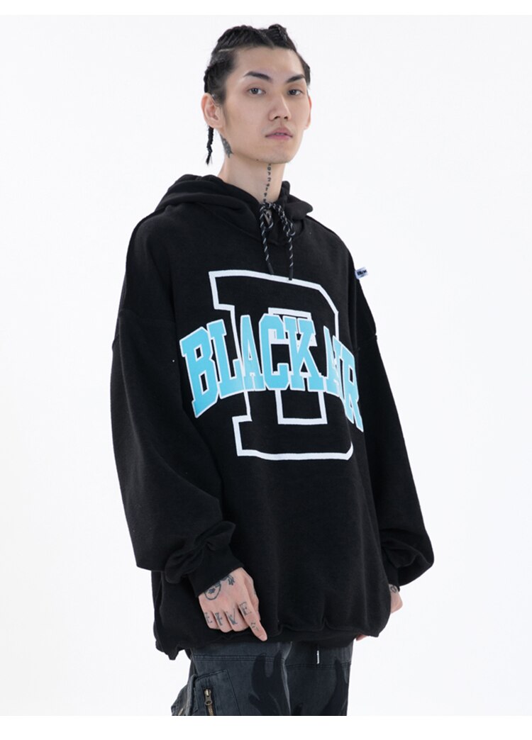 Men's hoodie featuring hit color design and letter patch, perfect for casual streetwear.