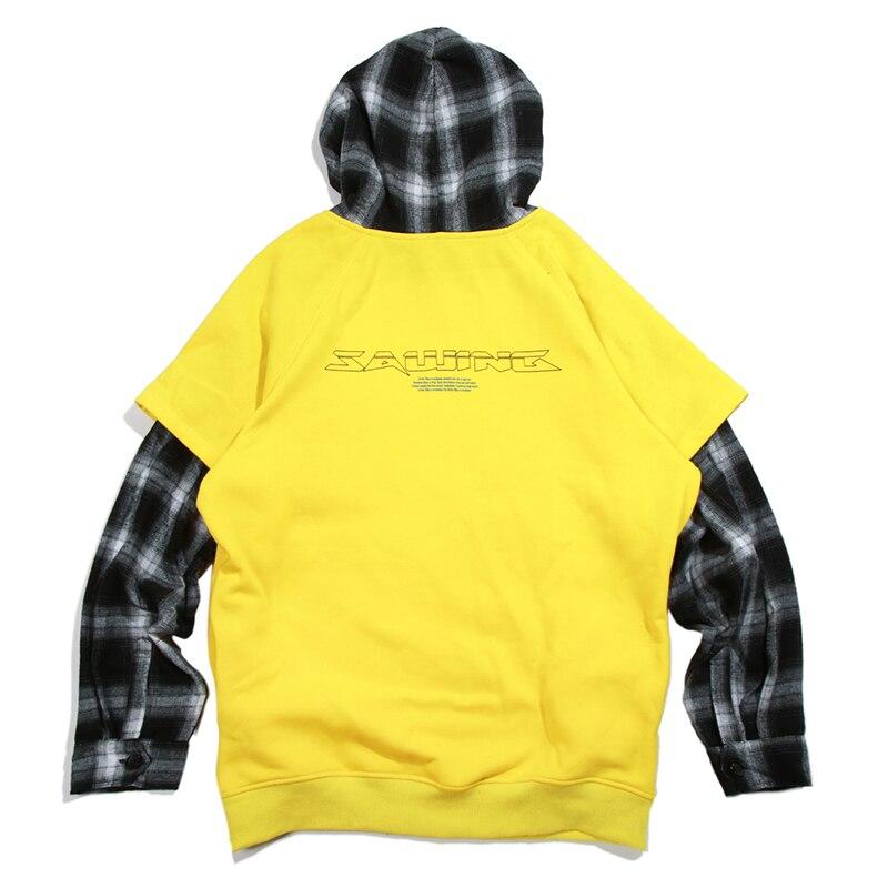 Men's oversized hooded pullover featuring plaid print sleeves in black and yellow, perfect for streetwear style.