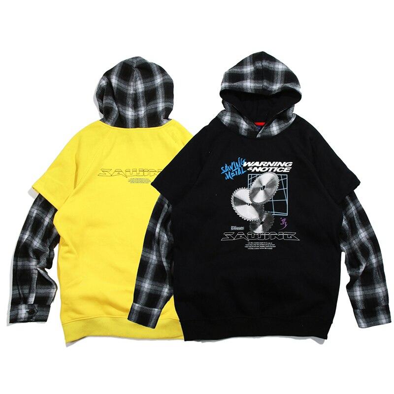 Men's oversized hooded pullover featuring plaid print sleeves in black and yellow, perfect for streetwear style.