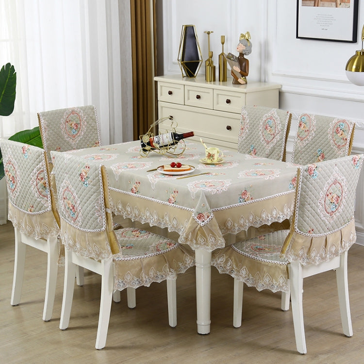 Elegant home dining table and chair non-slip cover in fabric with embroidered lace, perfect for enhancing dining aesthetics and functionality.