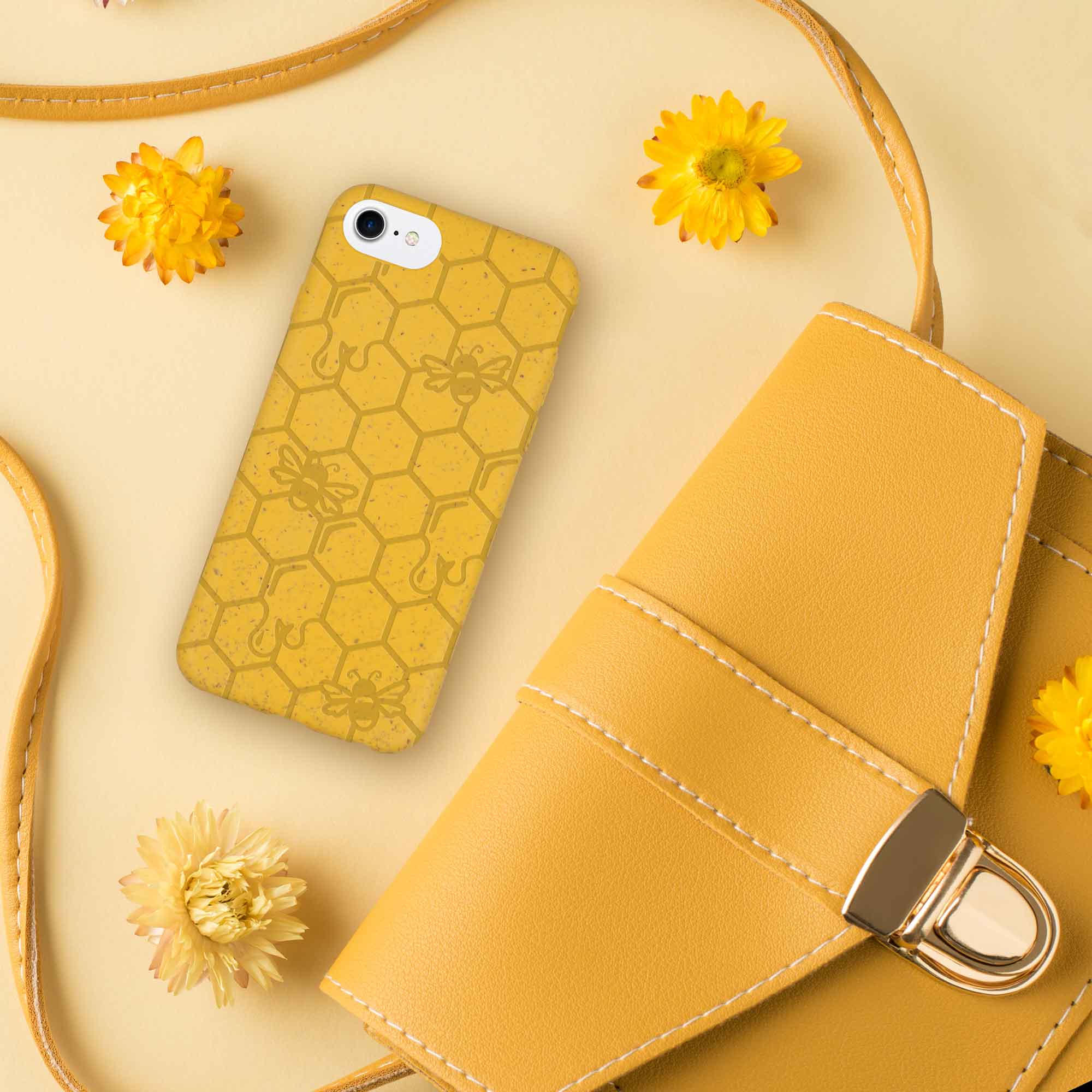 Honey Bee Biodegradable phone case in yellow, orange, and black with a bee hive engraving, showcasing its eco-friendly design.