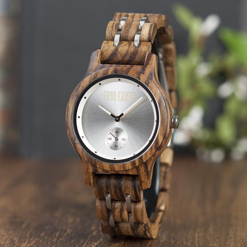 Ice Watch featuring a metallic face and wooden band, showcasing unique craftsmanship and natural materials.