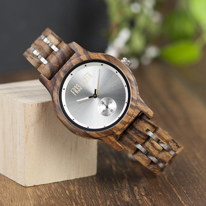 Ice Watch featuring a metallic face and wooden band, showcasing unique craftsmanship and natural materials.