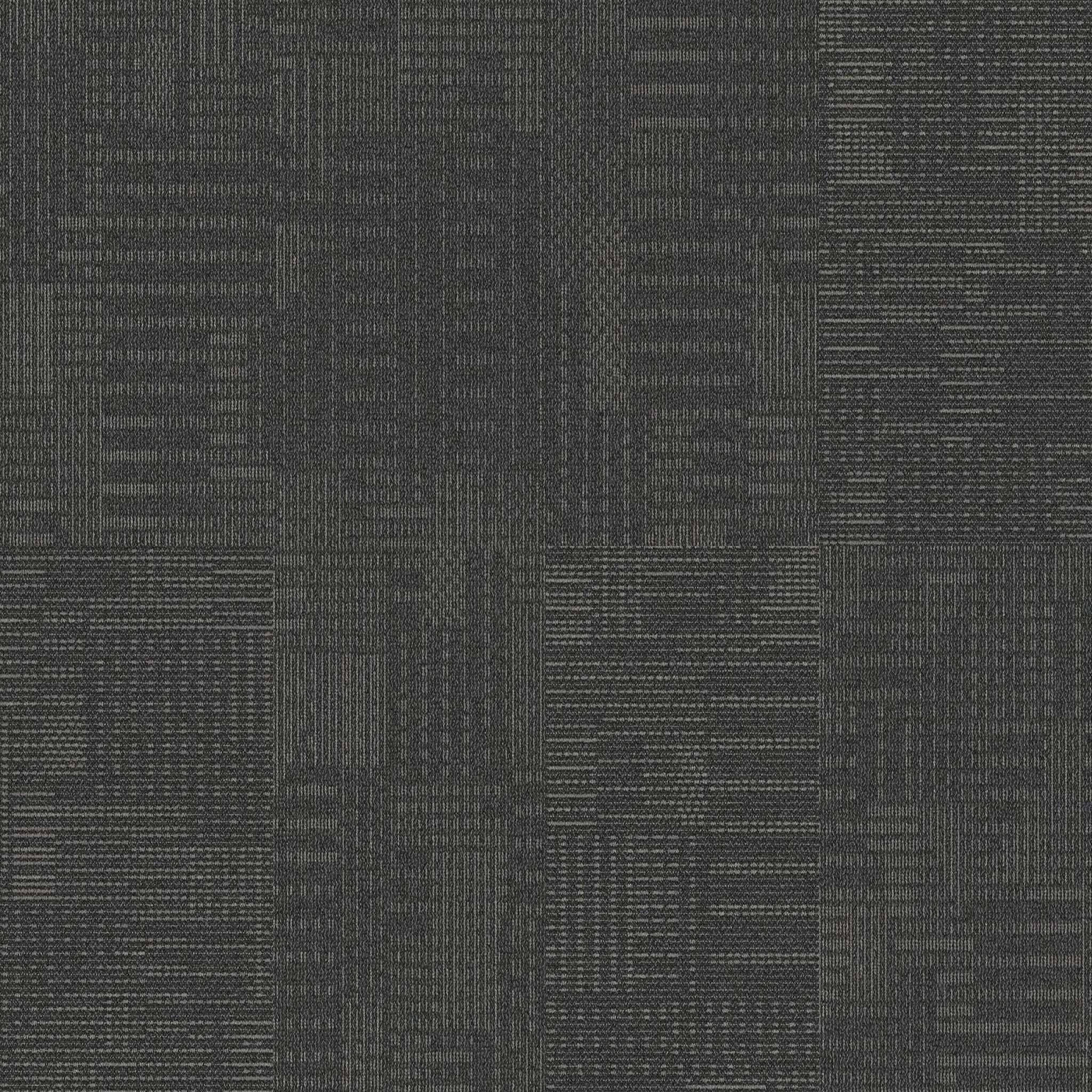 Interface CT101 Onyx carpet tiles featuring a unique dot and dash pattern, ideal for creative flooring designs.