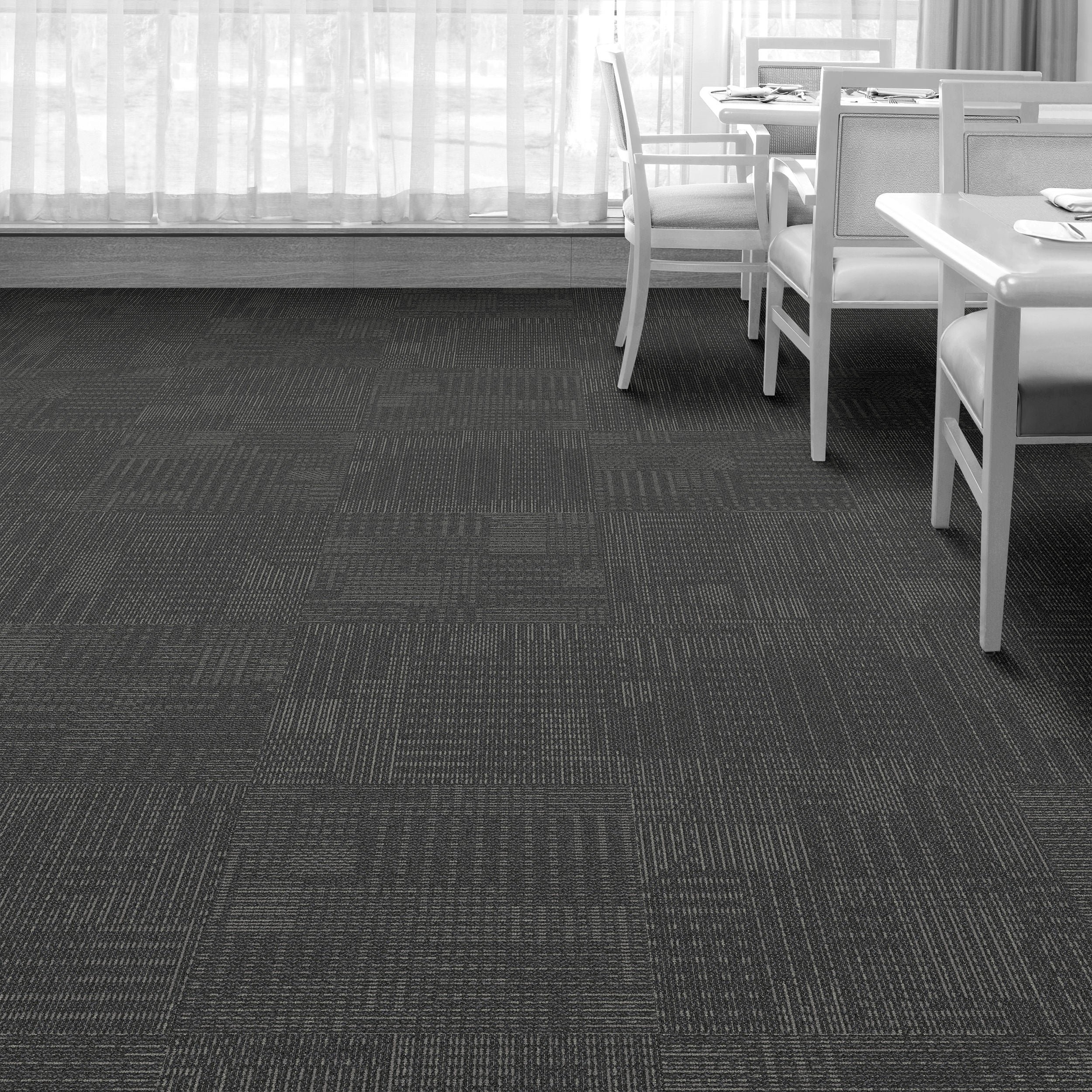 Interface CT101 Onyx carpet tiles featuring a unique dot and dash pattern, ideal for creative flooring designs.