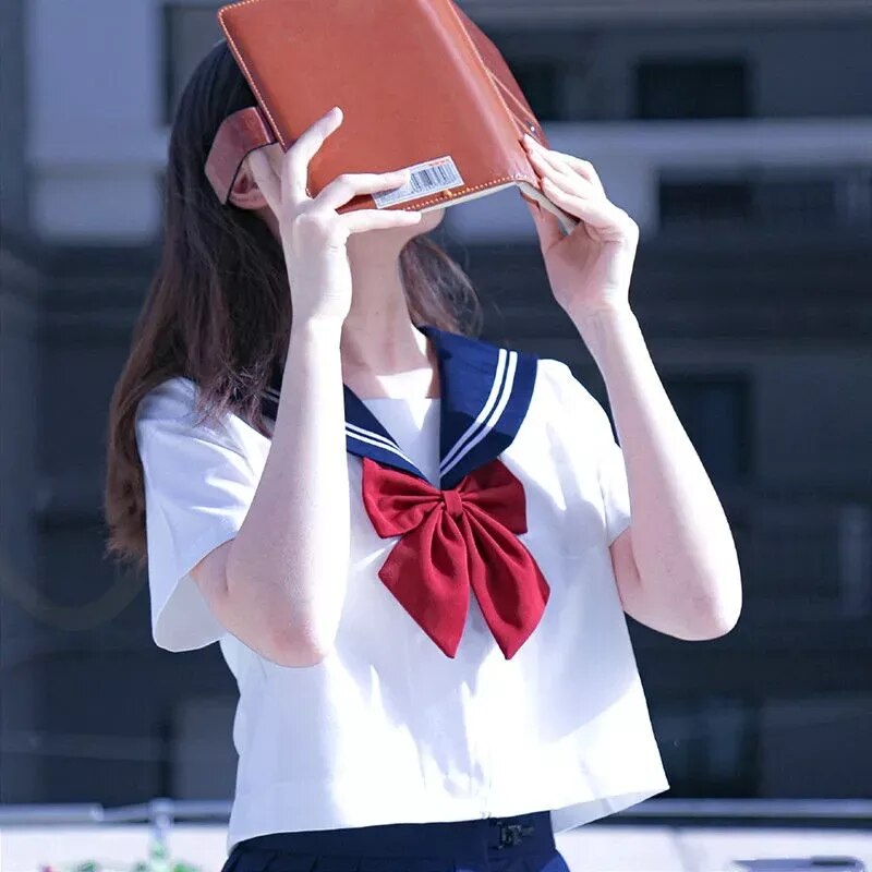 Japanese School Uniform Suit Sailor JK in navy color, featuring a sailor collar and pleated skirt, designed for girls and women.