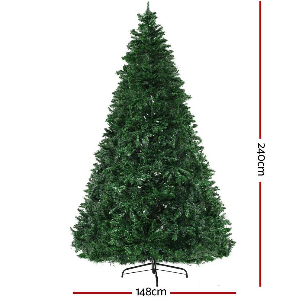 Jingle Jollys 2.4M LED Christmas Tree with multicoloured lights and bushy branches, set up for festive decorations.