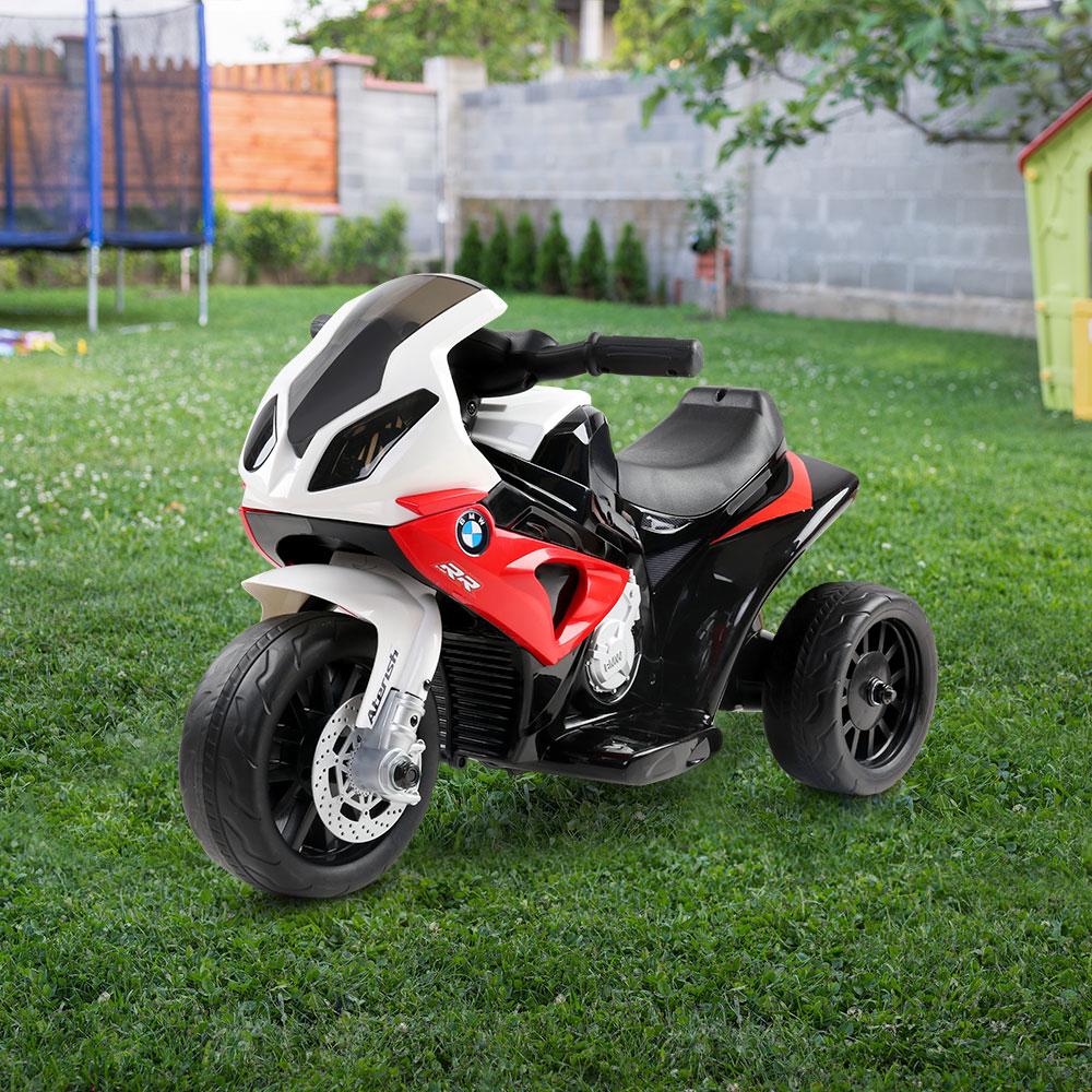 Red BMW licensed S1000RR kids ride on motorbike with sporty design and features.