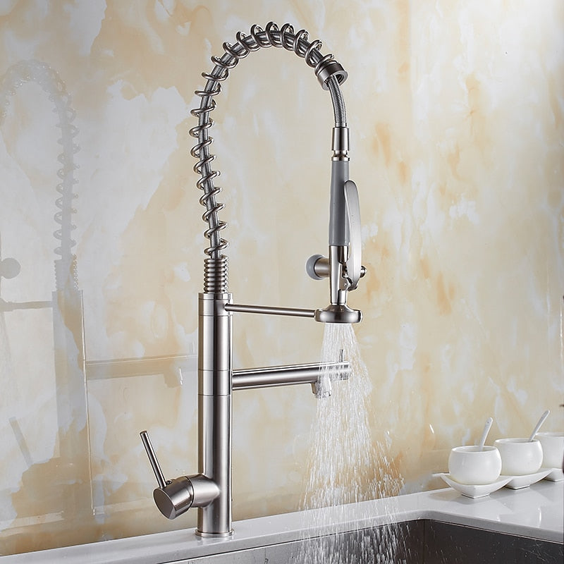 Chrome brass tall kitchen faucet with pull-out spray and single handle, featuring a modern design and 360-degree swivel spout.