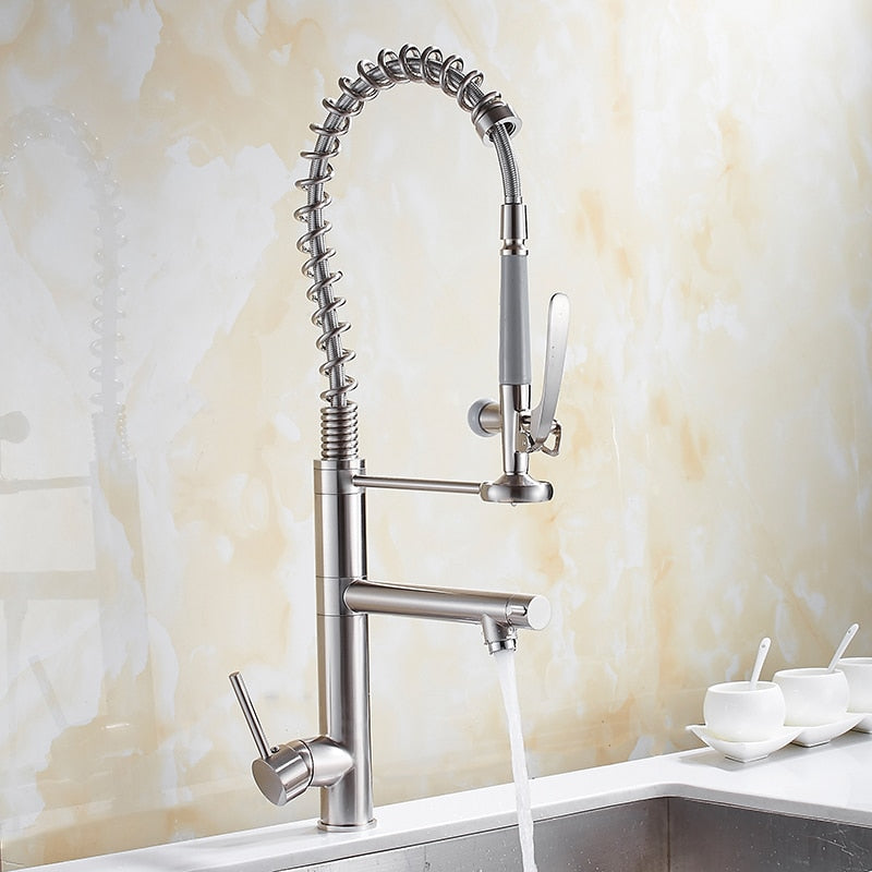 Chrome brass tall kitchen faucet with pull-out spray and single handle, featuring a modern design and 360-degree swivel spout.