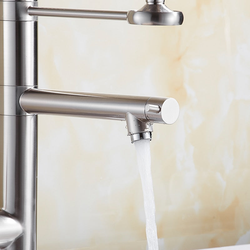 Chrome brass tall kitchen faucet with pull-out spray and single handle, featuring a modern design and 360-degree swivel spout.