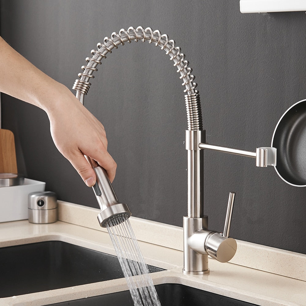 WANFAN brushed brass kitchen faucet with single lever and pull-down spray head, showcasing a contemporary design for modern kitchens.