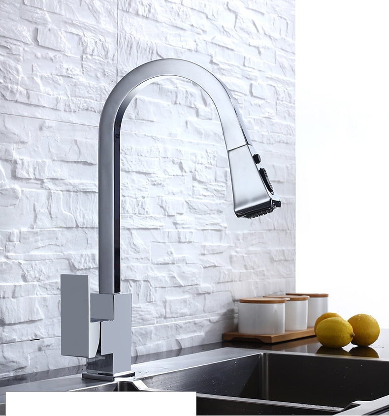 A sleek silver kitchen faucet with a pull-out tap and single hole handle, made of solid brass, featuring a 360-degree swivel design.