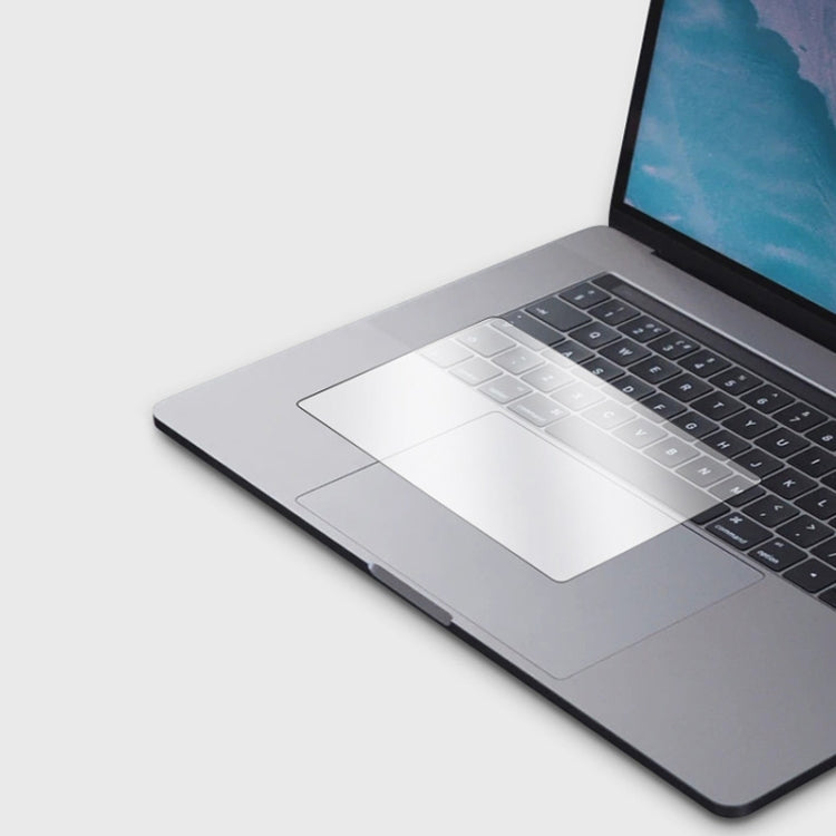 Transparent frosted touchpad film for MacBook Pro 16 inch, showcasing its dust-proof and scratch-resistant features.