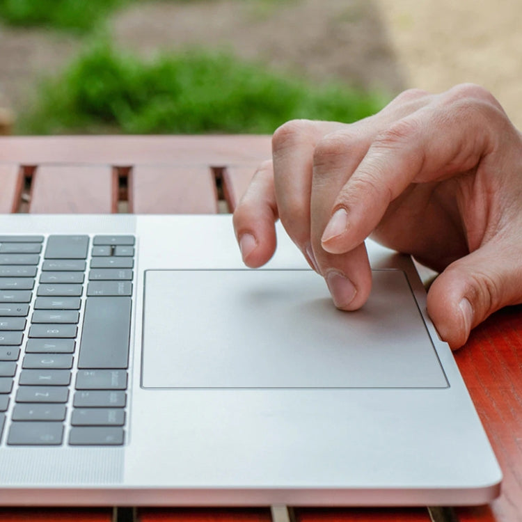 Transparent frosted touchpad film for MacBook Pro 16 inch, showcasing its dust-proof and scratch-resistant features.