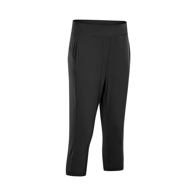 Women wearing high waist yoga capri joggers, showcasing stretchy fabric and side pocket.