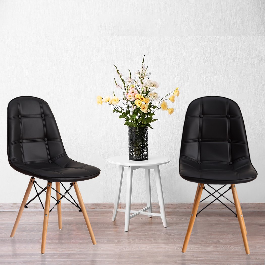 Levede 4x Retro Replica PU Leather Dining Chairs in black with beech wooden legs, showcasing a modern and stylish design.