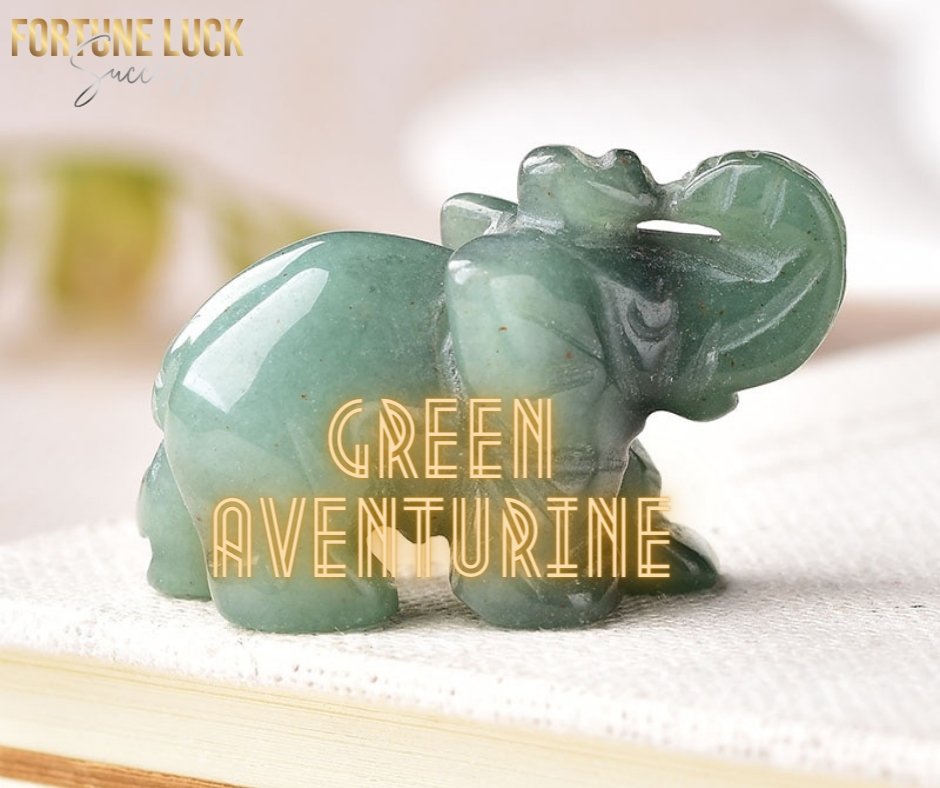 A limited edition set of four crystal elephants, each handcrafted from unique crystals including amethyst, green aventurine, tiger's eye, and turquoise, symbolizing good fortune.