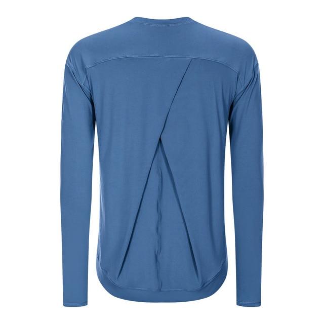 A lightweight long sleeve workout shirt for women, featuring a loose fit and thumb holes, ideal for yoga and fitness activities.