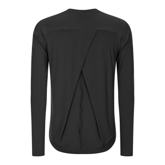 A lightweight long sleeve workout shirt for women, featuring a loose fit and thumb holes, ideal for yoga and fitness activities.