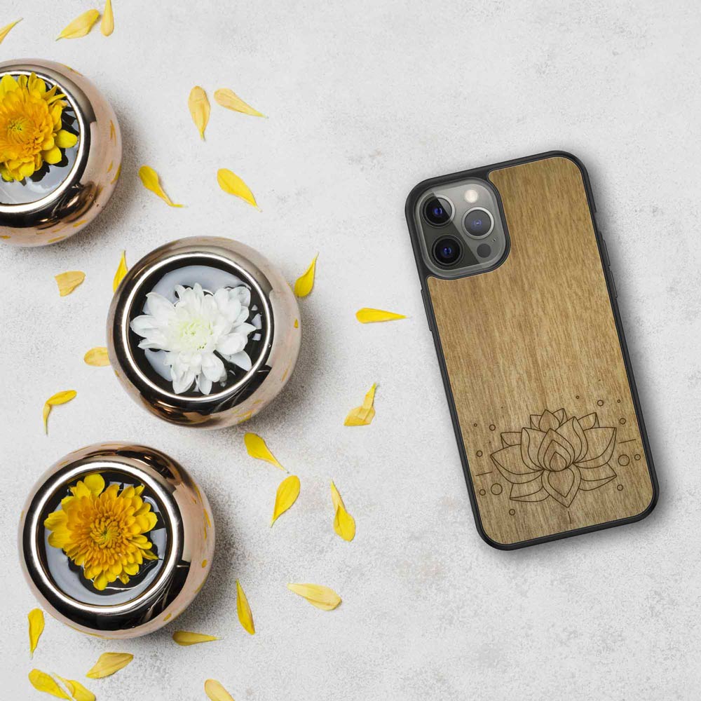 Engraved Lotus Flower wooden phone case showcasing intricate floral design and natural wood grain.