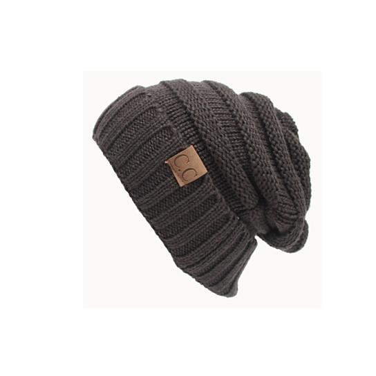 A cozy Loungy And Slouchy Beanie Hat made of cable knit, showcasing its soft texture and slouchy style, perfect for winter lounging.