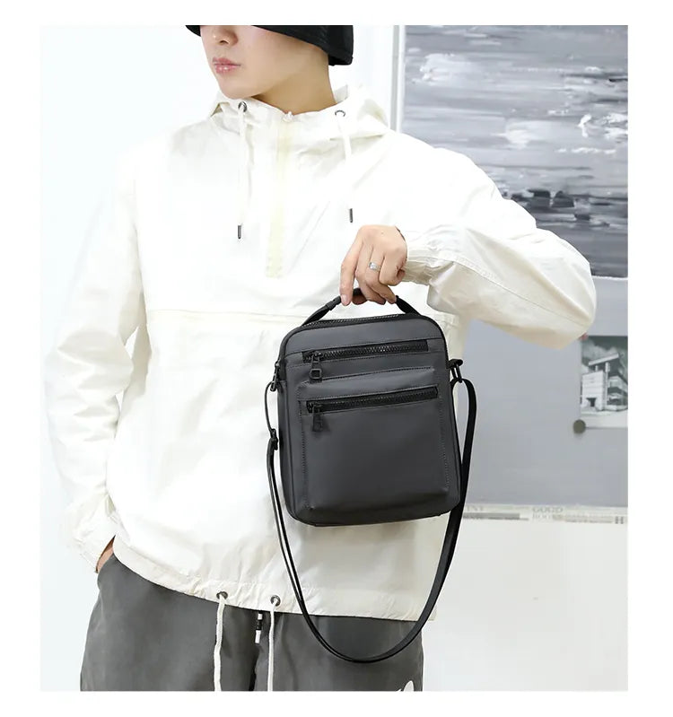 Man Classic Messenger Bag in high-quality nylon, showcasing its multifunctional design and compact size.