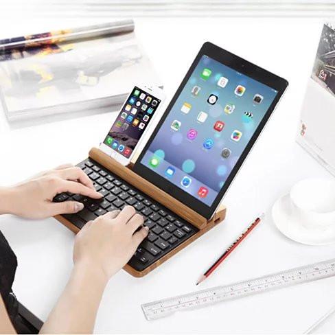 Master of All Bluetooth Keyboard with natural bamboo casing and built-in device stand.