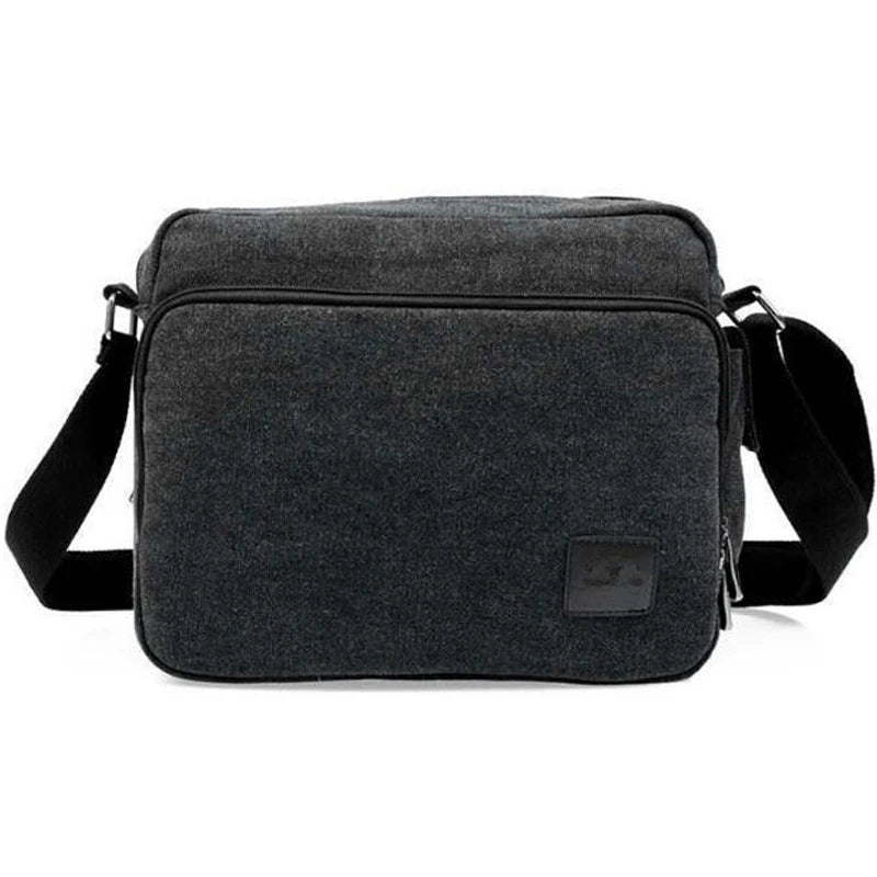 Men's vintage canvas messenger bag with adjustable strap and multiple compartments, perfect for daily use.