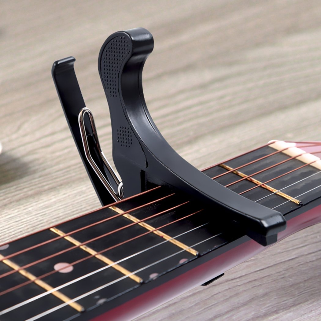 Metal guitar stand with rubber feet, holding electric and acoustic guitars securely, featuring a sleek black design.