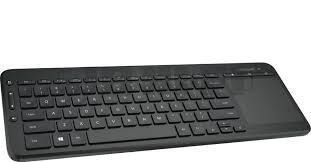 Microsoft All In One Media Keyboard featuring a USB port and integrated multi-touch trackpad, designed for seamless navigation and media control.