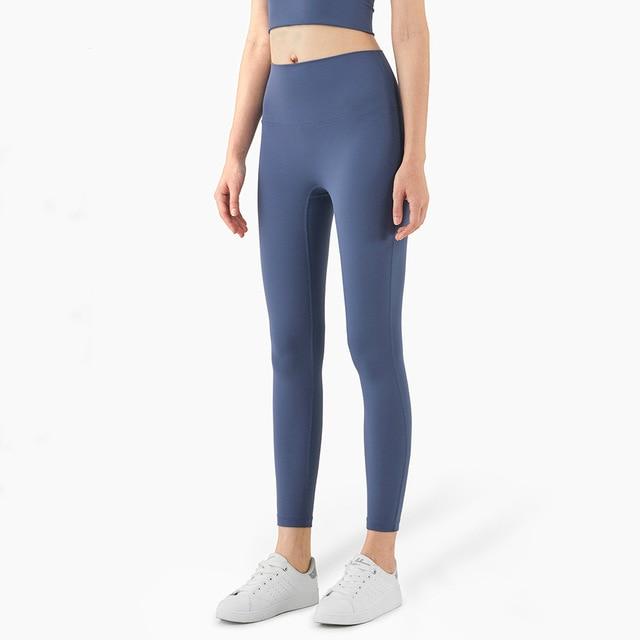 Women wearing mid compression second-skin feel gym tights, showcasing their flexibility and comfort during a workout.