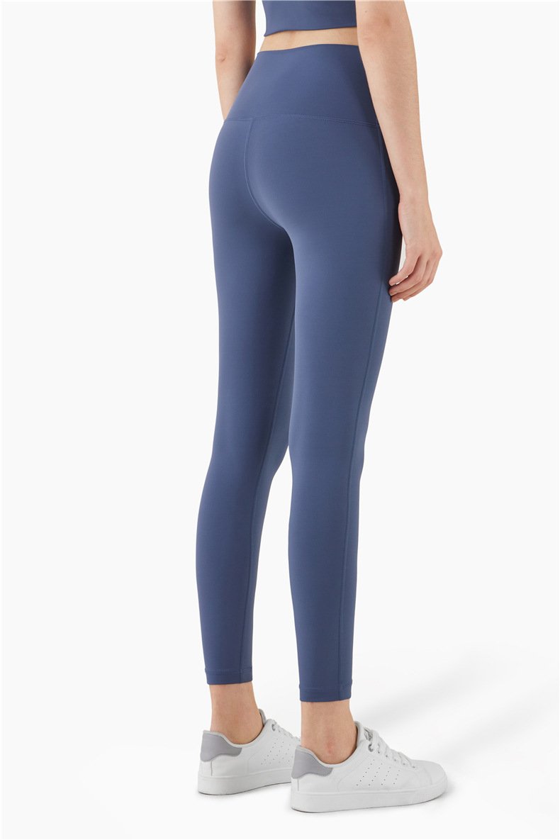 Women wearing mid compression second-skin feel gym tights, showcasing their flexibility and comfort during a workout.