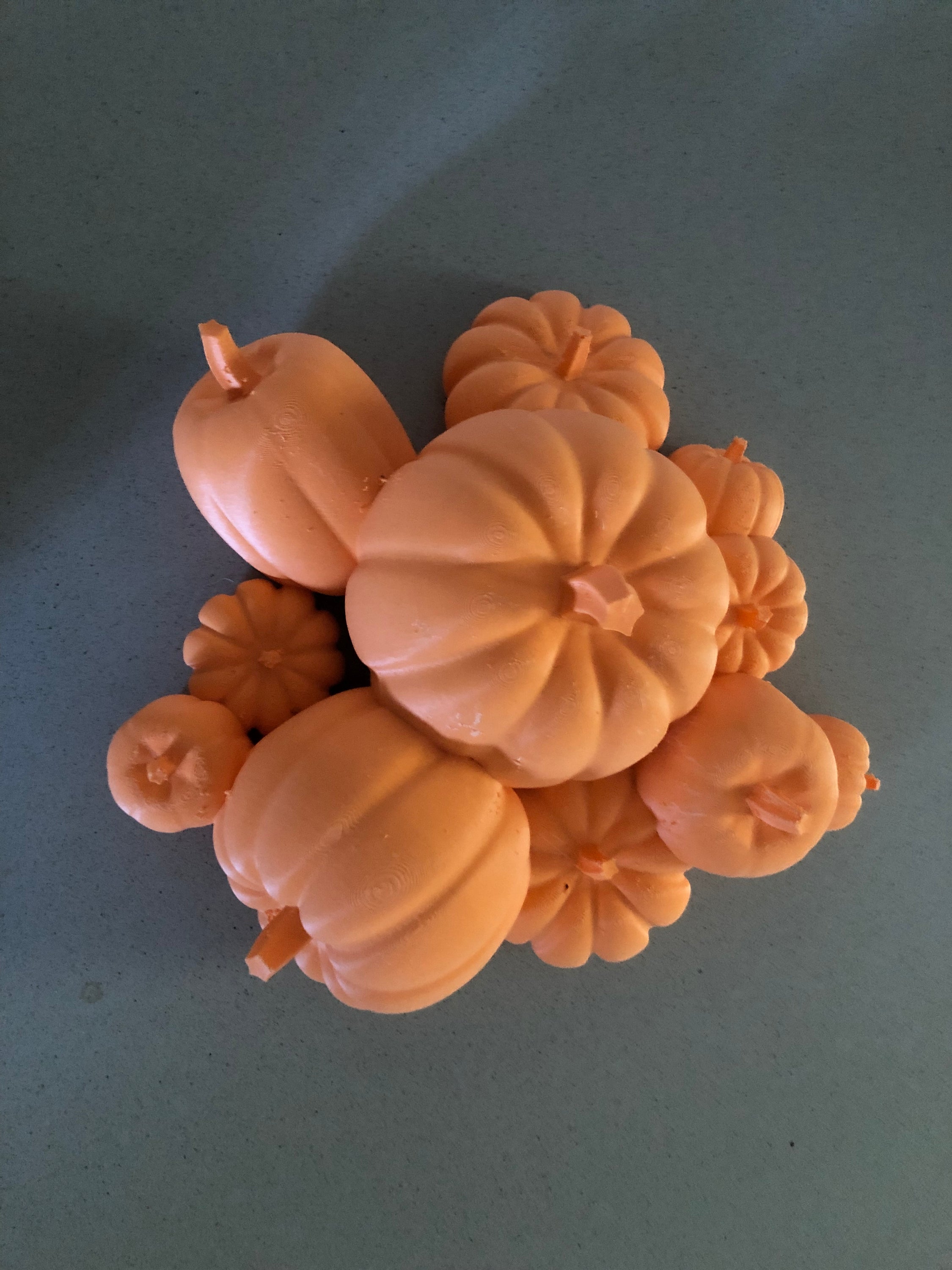 A vibrant Mini Pumpkin Patch featuring bright orange pumpkins, perfect for indoor or outdoor decoration, measuring 4.33 inches tall and 10.23 inches wide.