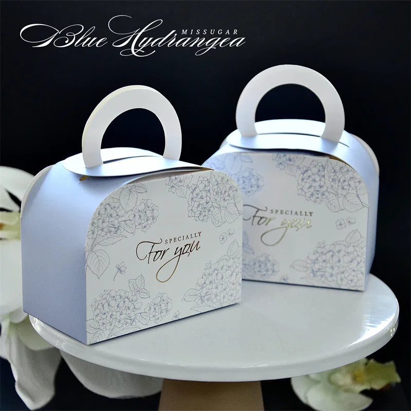 Mini Ramadan portable gift box in various colors, ideal for Eid Mubarak celebrations, featuring a ribbon and sturdy paperboard design.