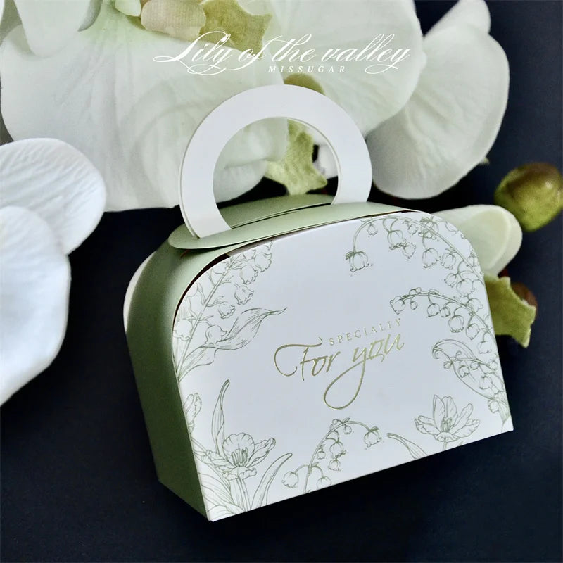 Mini Ramadan portable gift box in various colors, ideal for Eid Mubarak celebrations, featuring a ribbon and sturdy paperboard design.