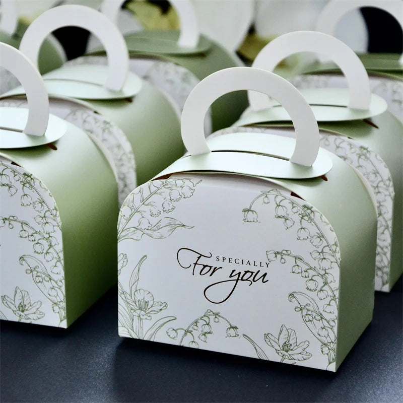 Mini Ramadan portable gift box in various colors, ideal for Eid Mubarak celebrations, featuring a ribbon and sturdy paperboard design.