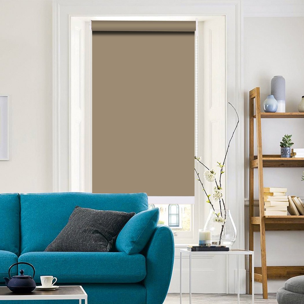 Modern Blockout Roller Blinds in tan color, showcasing full sun shading and elegant design, perfect for home decor.