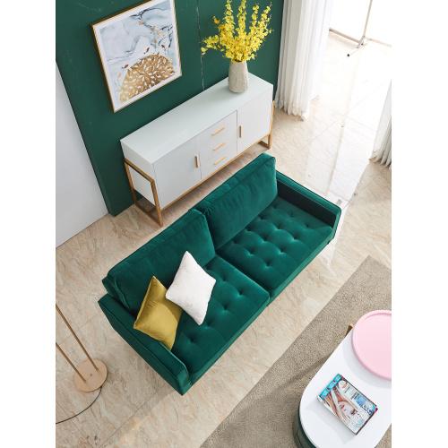 Modern Velvet fabric sofa in emerald green with golden metal legs and decorative pillows.