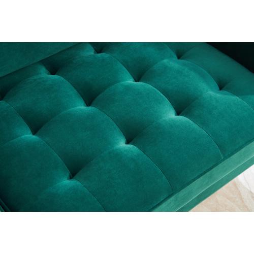 Modern Velvet fabric sofa in emerald green with golden metal legs and decorative pillows.