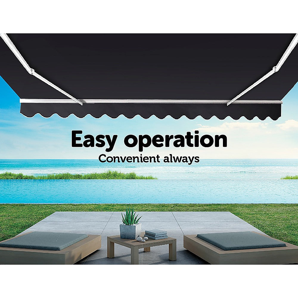 Motorised Outdoor Folding Arm Awning in grey, showcasing its retractable design and scalloped trim, perfect for patios and balconies.