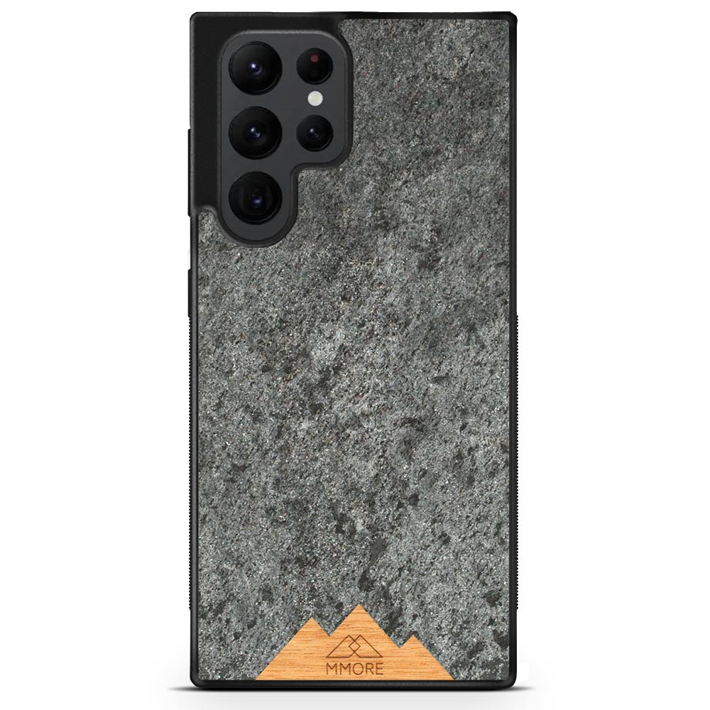 Mountain Stone Phone Case showcasing unique natural texture and sparkly grey color, held in hand against a natural backdrop.