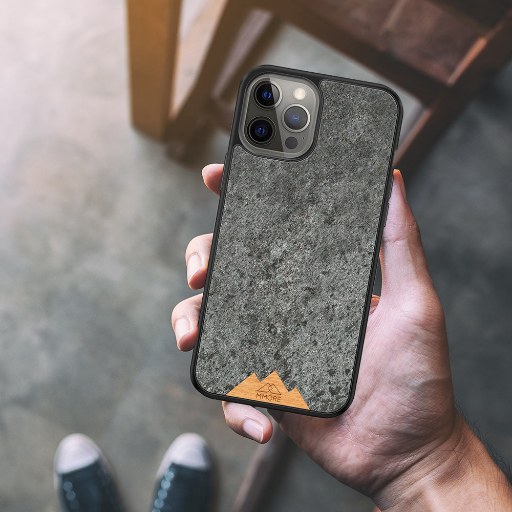 Mountain Stone Phone Case showcasing unique natural texture and sparkly grey color, held in hand against a natural backdrop.