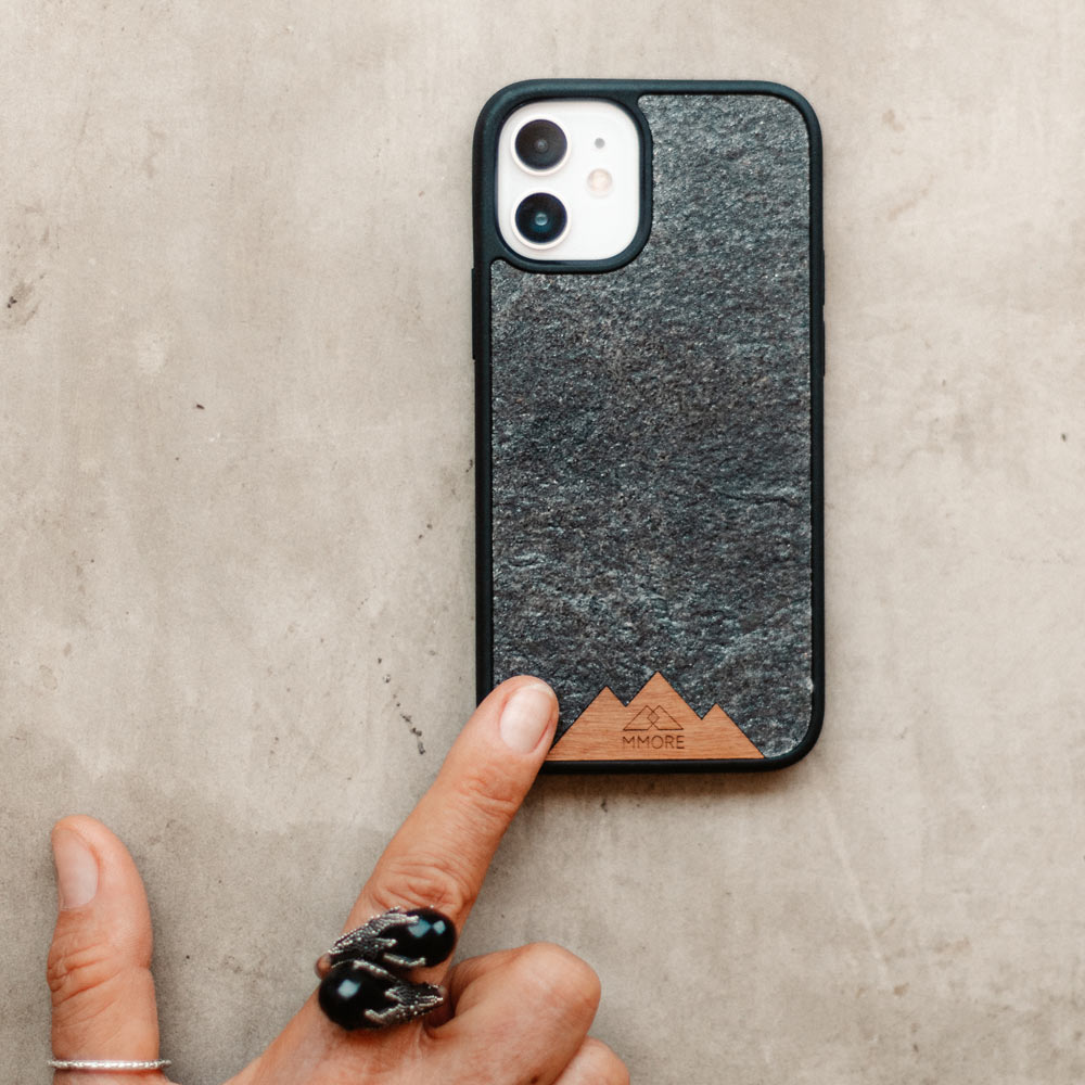 Mountain Stone Phone Case showcasing unique natural texture and sparkly grey color, held in hand against a natural backdrop.