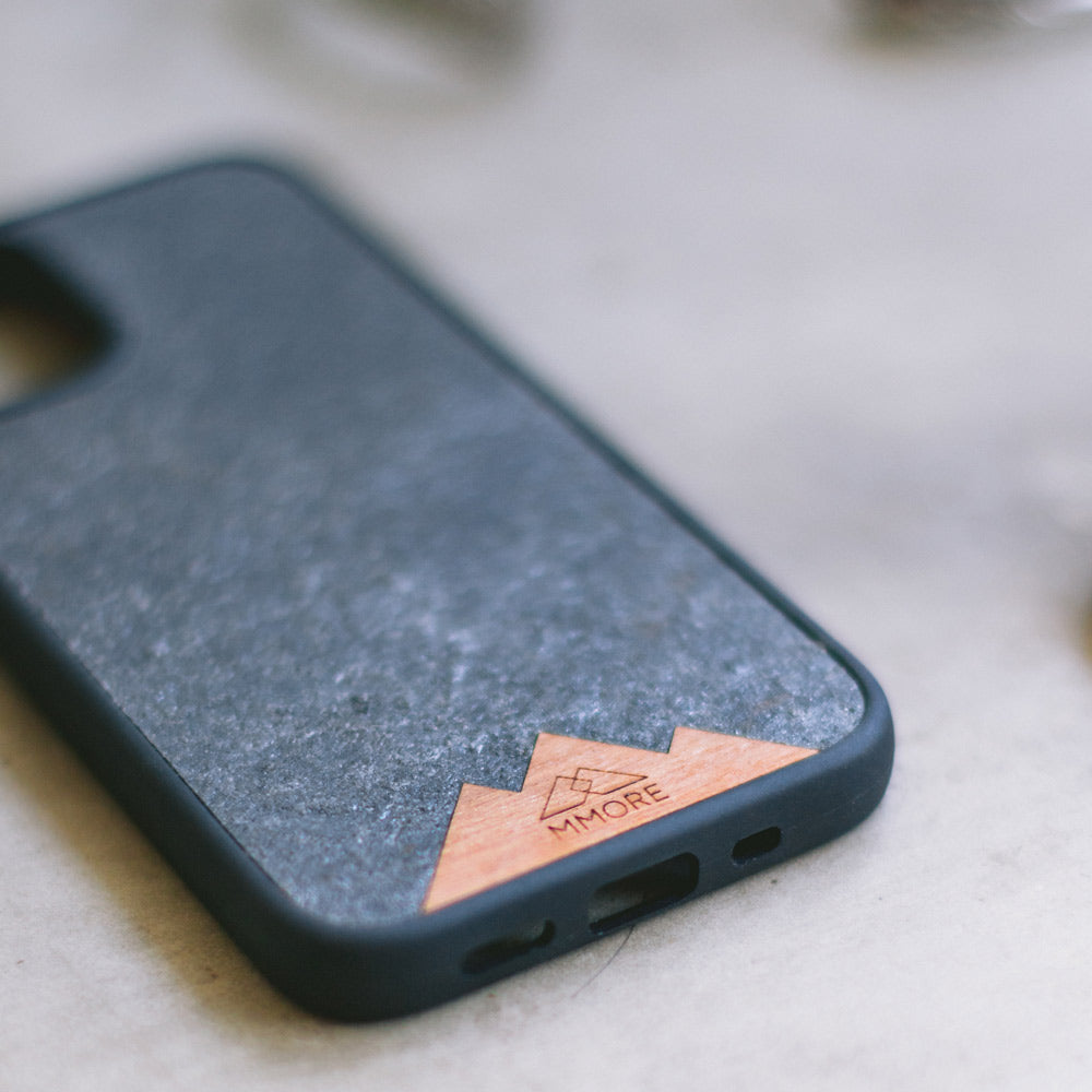 Mountain Stone Phone Case showcasing unique natural texture and sparkly grey color, held in hand against a natural backdrop.