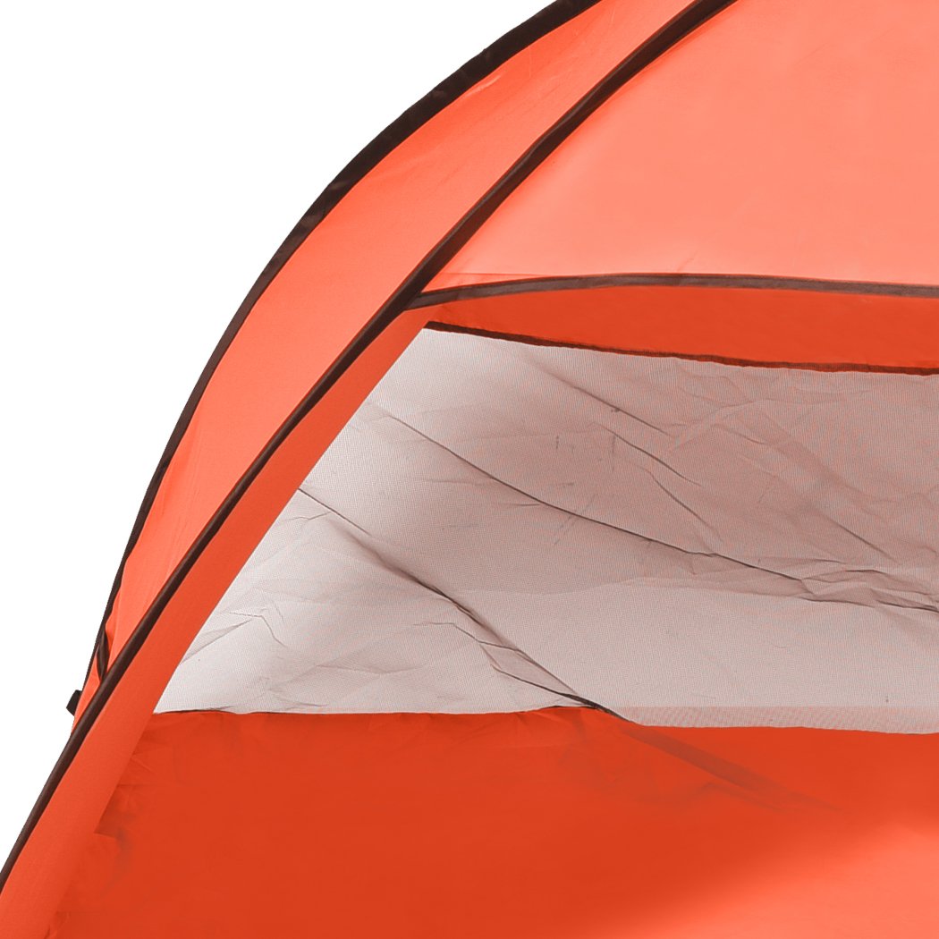 Mountview Pop Up Beach Tent in vibrant orange color, spacious enough for 4 people, set up on a sandy beach with a clear blue sky.