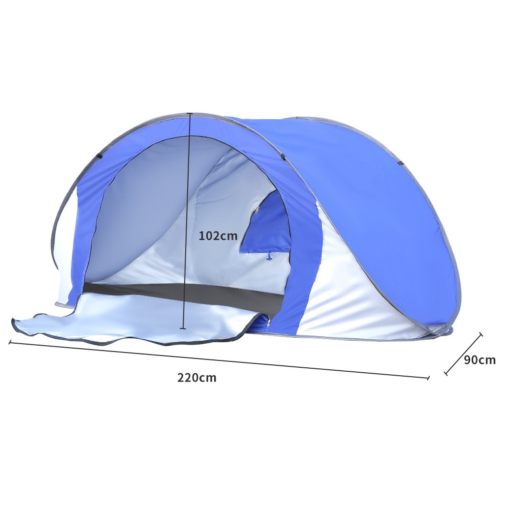 Mountview Pop Up Tent in blue color set up on the beach, showcasing its spacious interior and automatic opening feature.