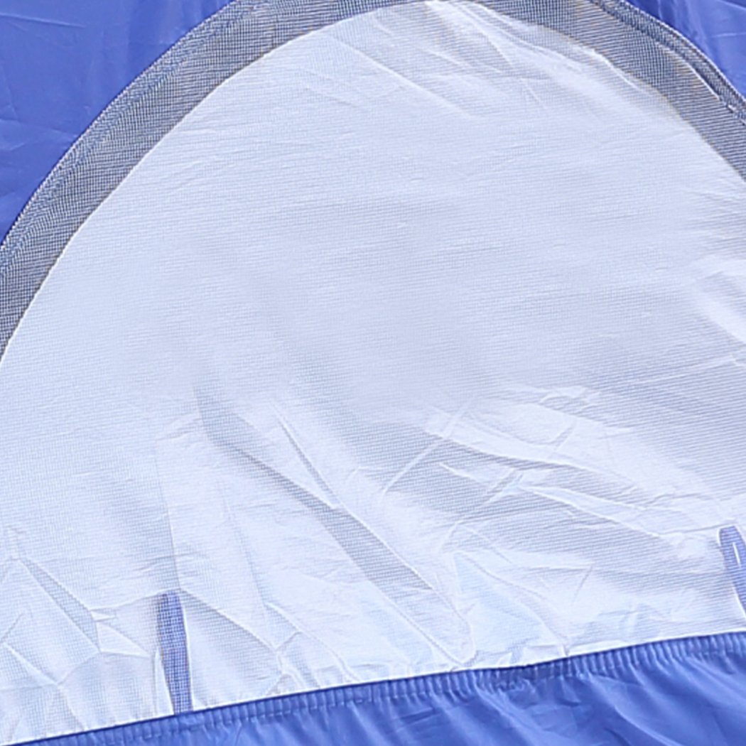 Mountview Pop Up Tent in blue color set up on the beach, showcasing its spacious interior and automatic opening feature.