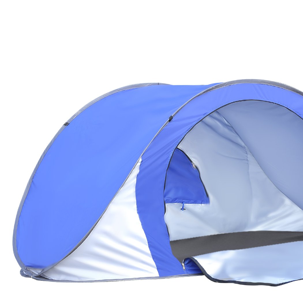 Mountview Pop Up Tent in blue color set up on the beach, showcasing its spacious interior and automatic opening feature.